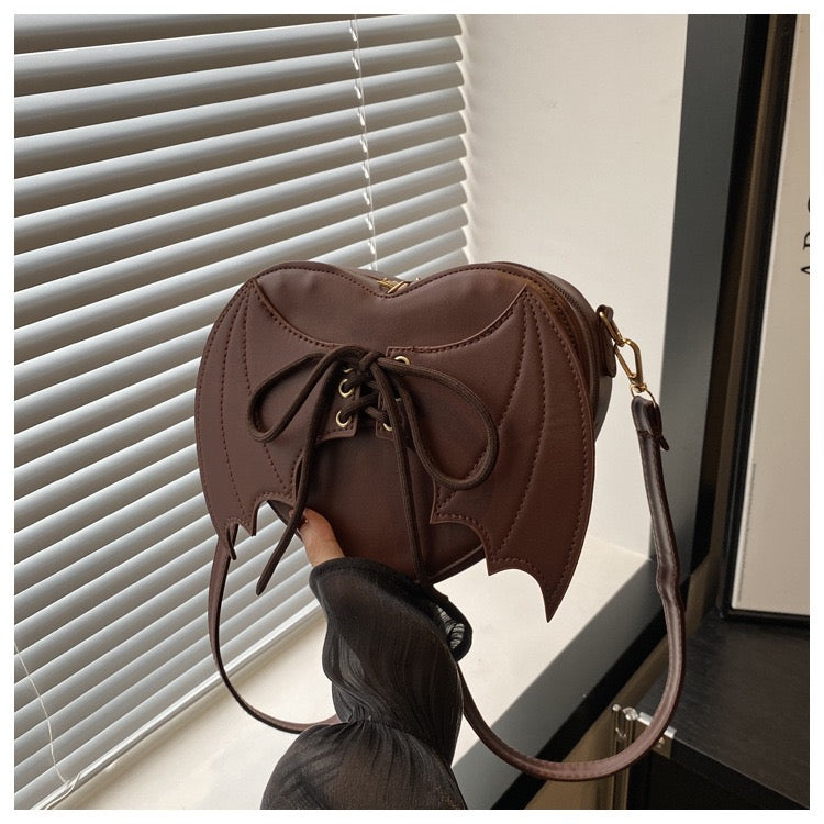 heart shaped with bat wings purse