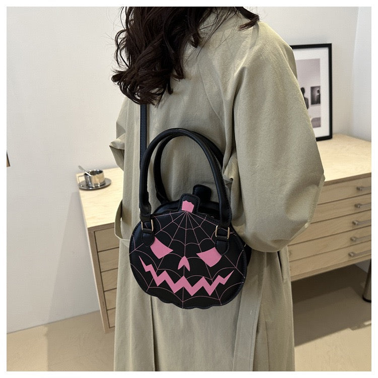 black & pink pumpkin purse