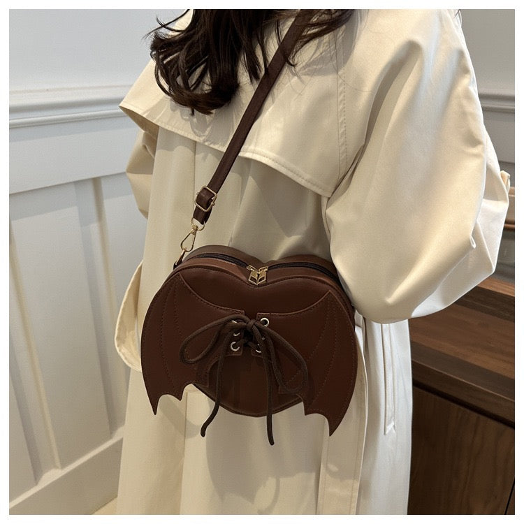 heart shaped with bat wings purse
