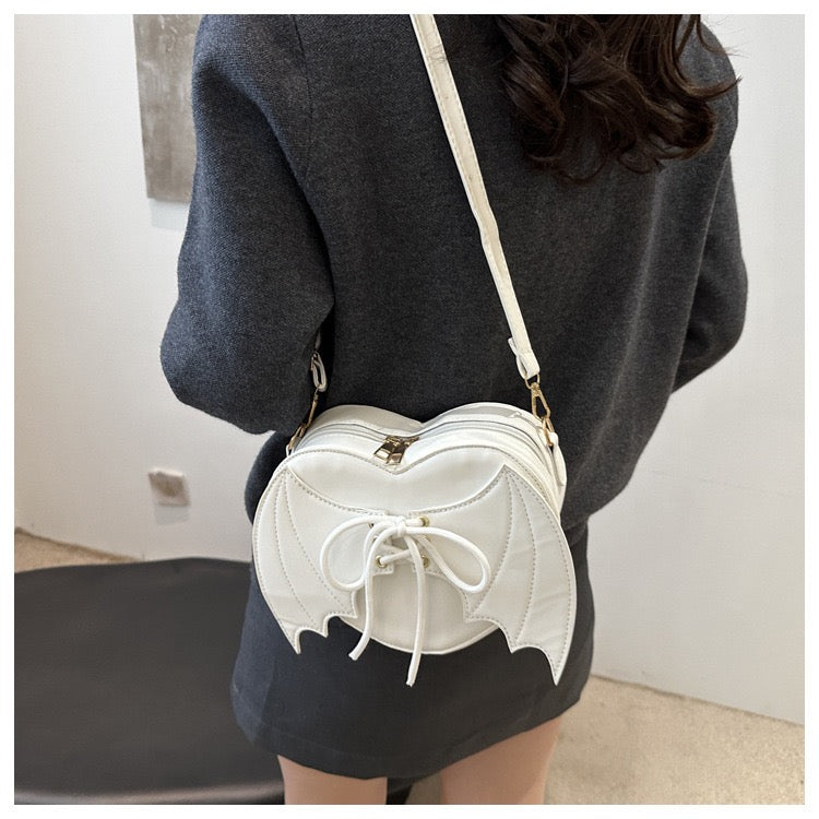 heart shaped with bat wings purse