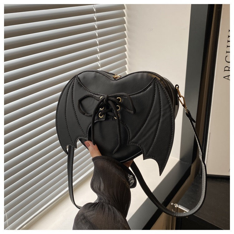 heart shaped with bat wings purse