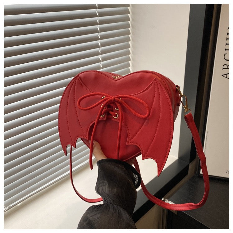 heart shaped with bat wings purse