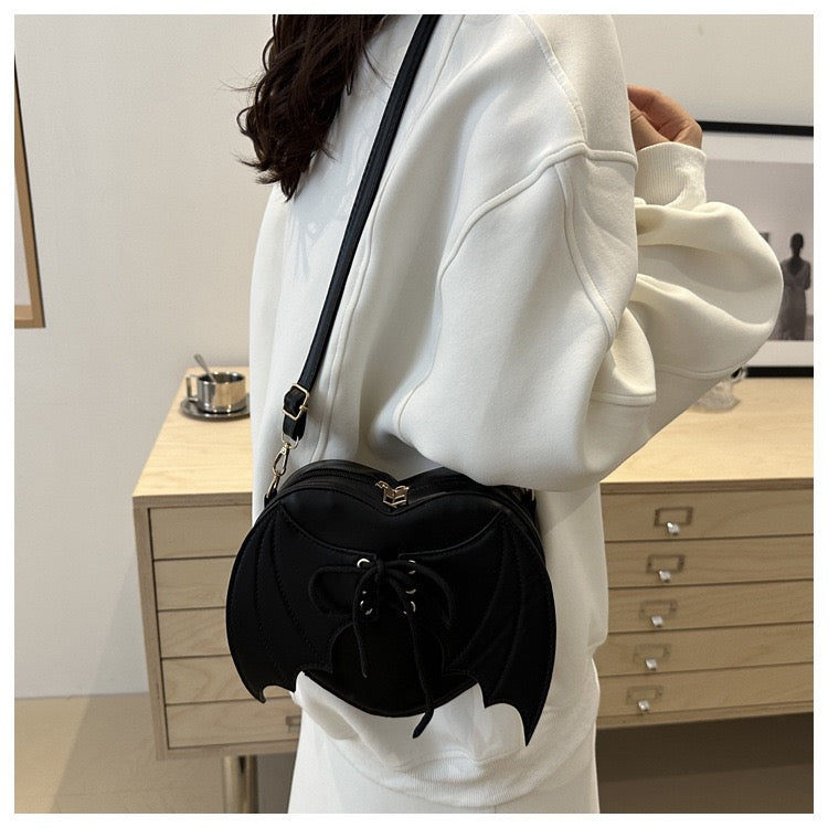 heart shaped with bat wings purse
