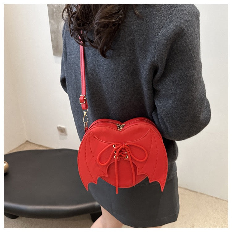 heart shaped with bat wings purse