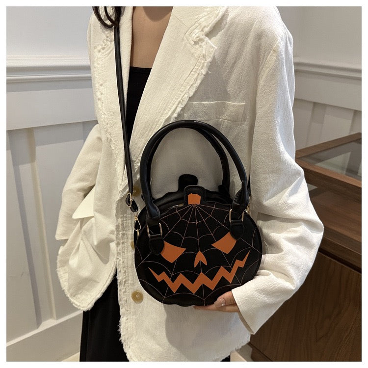 black and orange pumpkin purse